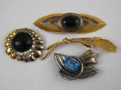 Appraisal: A mixed lot comprising four vintage costume jewellery brooches