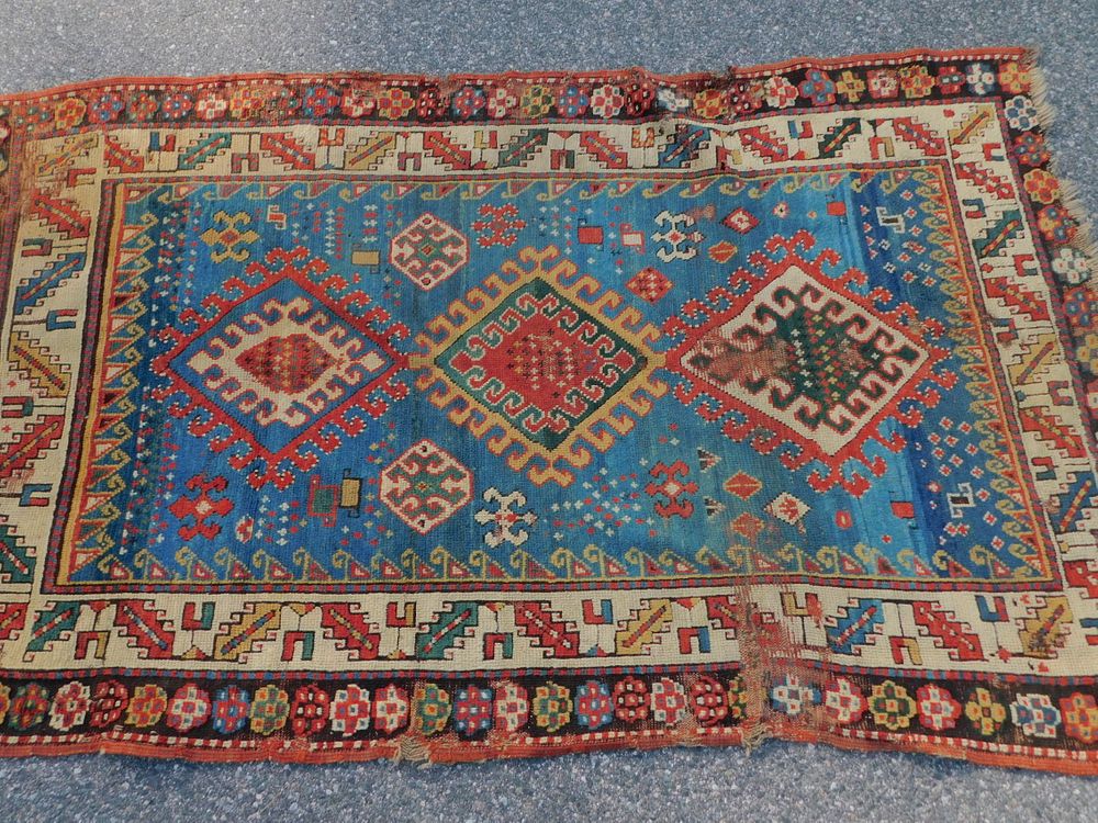 Appraisal: ANTIQUE KAZAK SCATTER RUG Antique Kazak scatter rug with triple