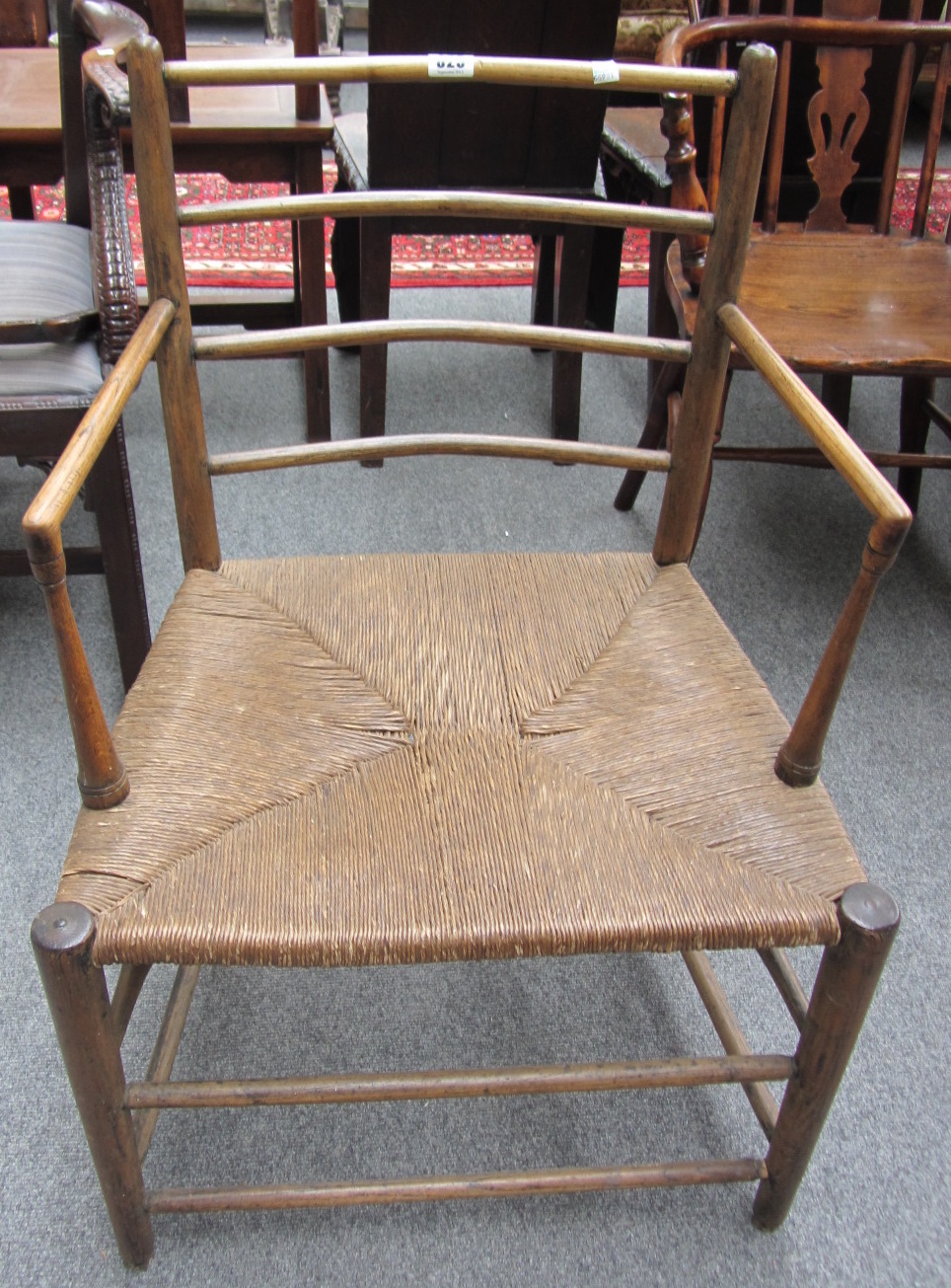 Appraisal: A th century rush seated ash open armchair of William