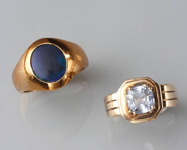 Appraisal: A black opal and k gold ring with a sapphire