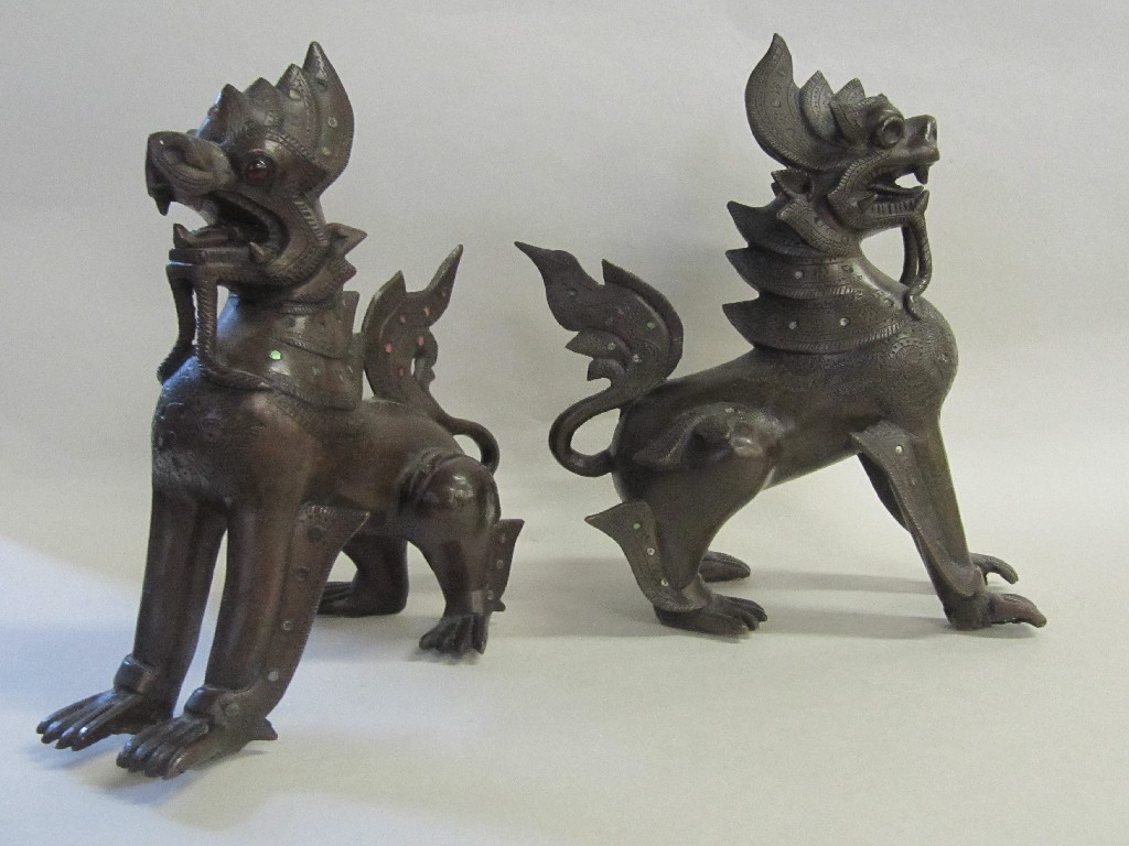 Appraisal: Pair of Burmese bronze elephants and griffins both with inlaid