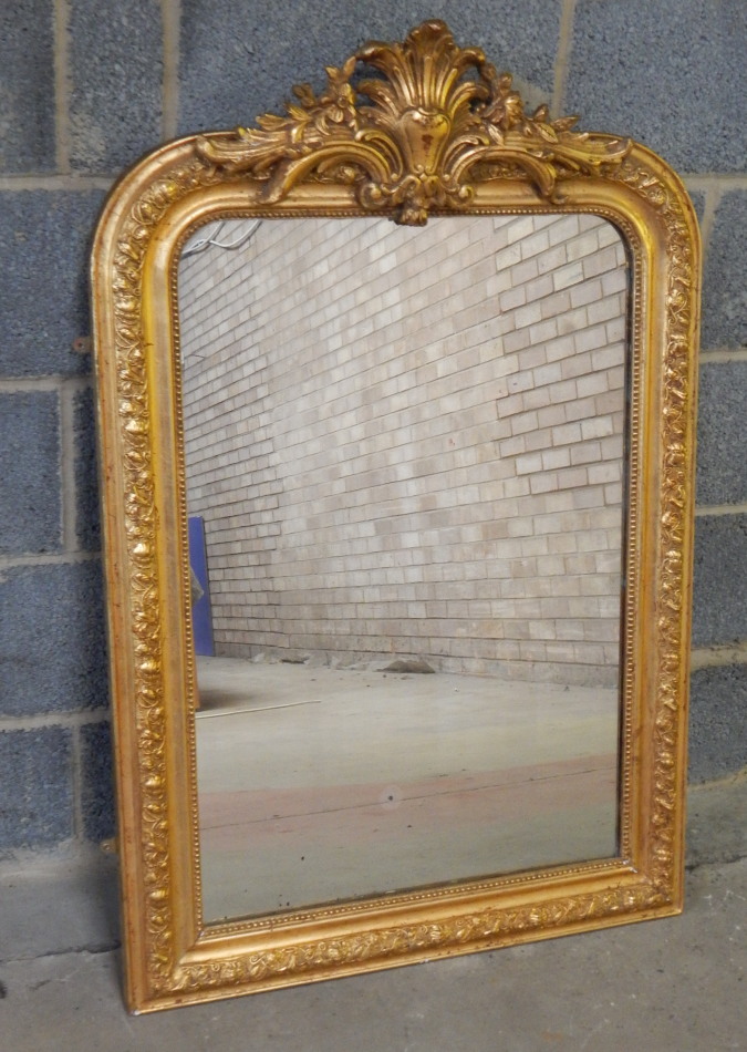 Appraisal: A George II style rococo plaster and giltwood wall mirror