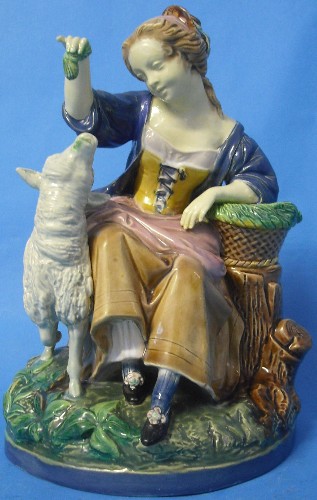 Appraisal: Mintons Majolica Figuregroup of Woman Feeding Sheep height cm impressed