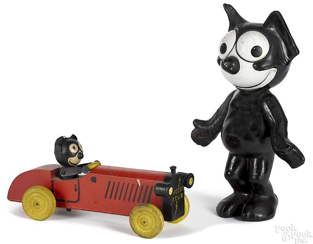 Appraisal: Speedy Felix the cat painted animated pull toy car Speedy