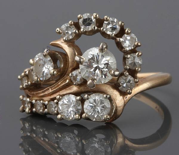 Appraisal: A diamond and k gold swirl ring estimated total diamond