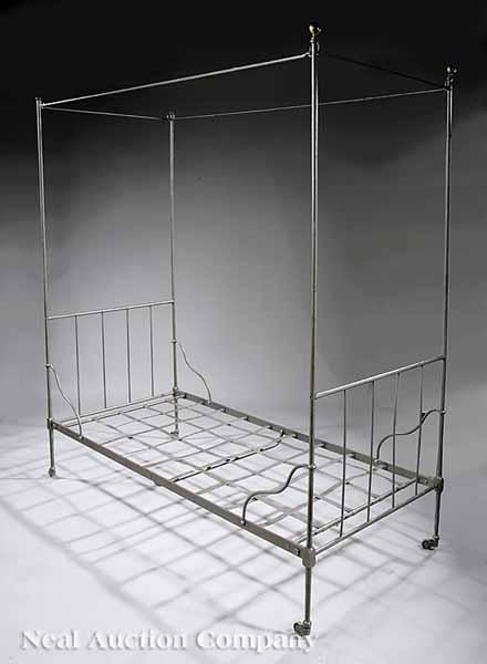 Appraisal: An Iron Convent Bed tubular steel posts fitted with mosquito