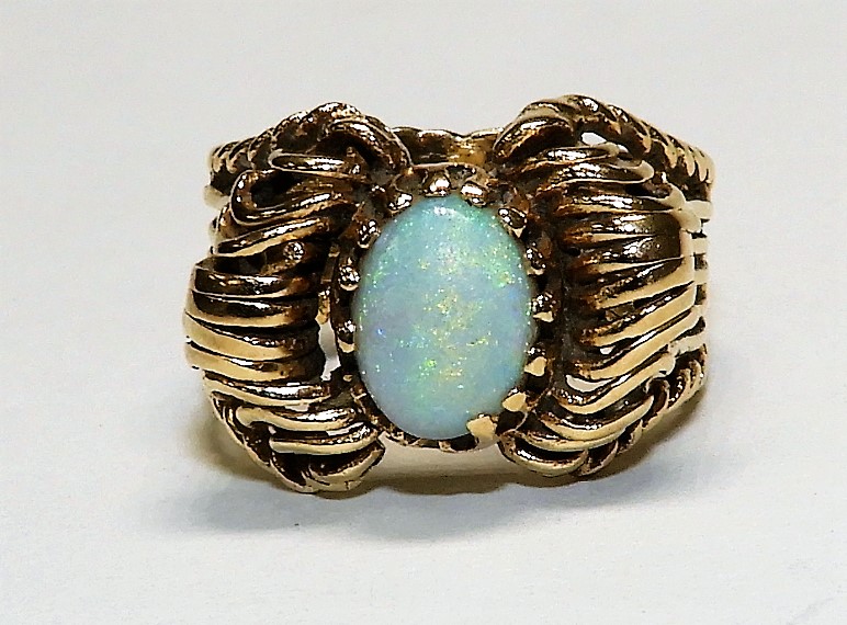 Appraisal: K GOLD OPAL LADIES RING th CenturyOval opal in twisted