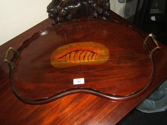 Appraisal: An antique mahogany kidney shaped tray with galleried sides shell