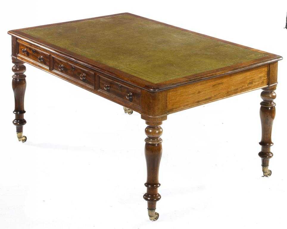 Appraisal: A VICTORIAN MAHOGANY LIBRARY TABLE with green leather inlet top