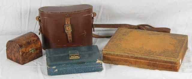 Appraisal: A pair of field glasses in a leather case a