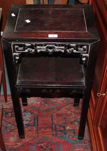 Appraisal: A CHINESE CHERRYWOOD TWO TIER LAMP TABLE with carved foliate