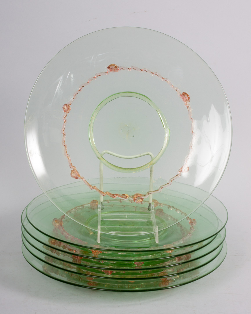 Appraisal: Seven Murano glass plates each with applied floral and ribbon