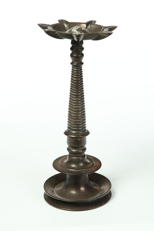 Appraisal: BRONZE LAMP Eastern late th century Spool turned column with