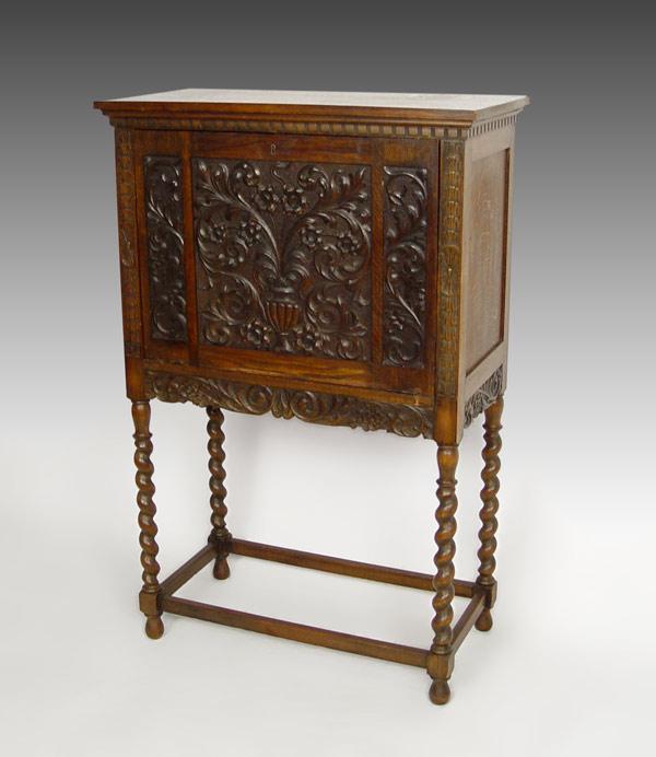 Appraisal: EARLY TH C CARVED QUARTER SAWN OAK CABINET Elaborately carved