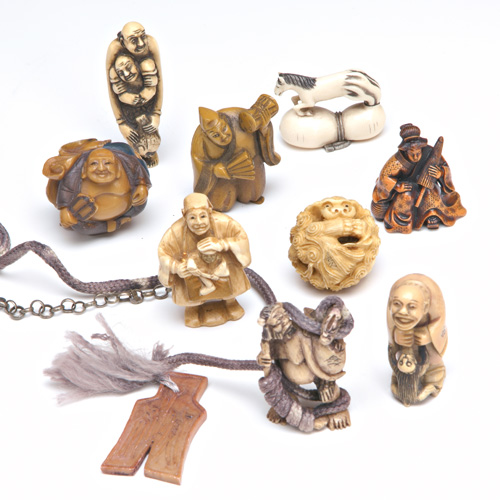 Appraisal: NETSUKE AND CARVINGS Ten ivory and bone netsuke or carvings