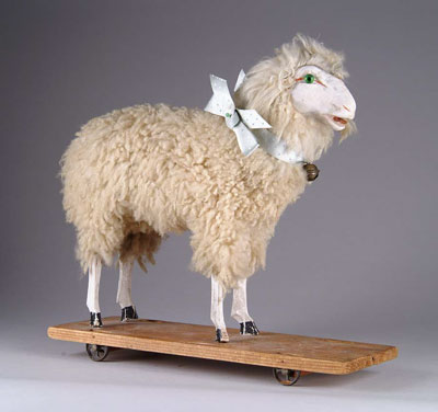 Appraisal: GERMAN SHEEP ON PLATFORM A fine wooly sheep with a