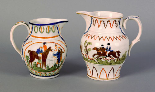 Appraisal: Two Prattware pitchers ca with relief hunting and horse racing