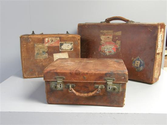 Appraisal: Four leather suitcases and a Pukka Luggage trunk PROVENANCE Thetis