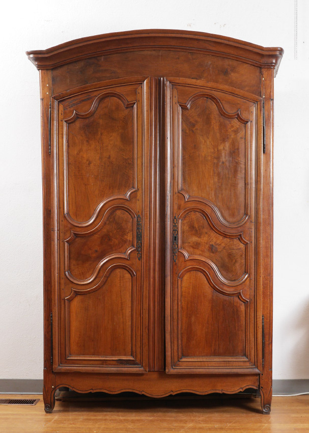 Appraisal: FRENCH WALNUT COUNTRY ARMOIRE Shaped top doors with shaped panels