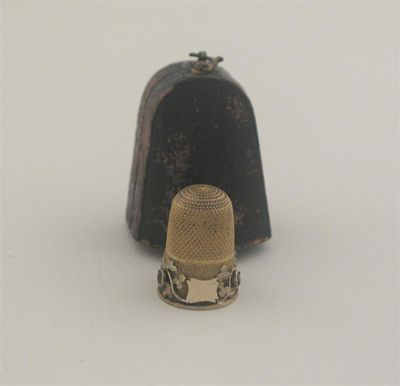 Appraisal: A late Victorian two colour gold thimble with applied trailing