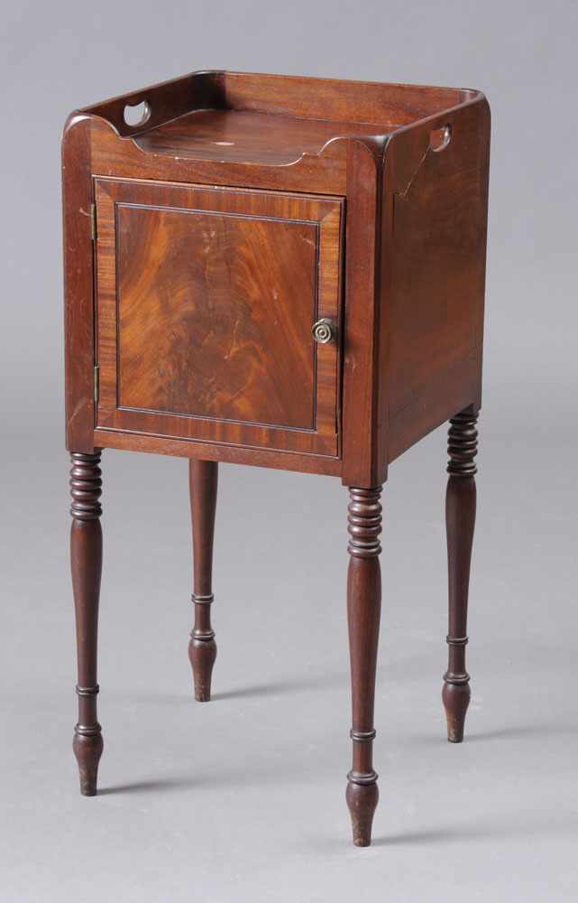 Appraisal: REGENCY CARVED MAHOGANY NIGHT STAND The galleried top above a