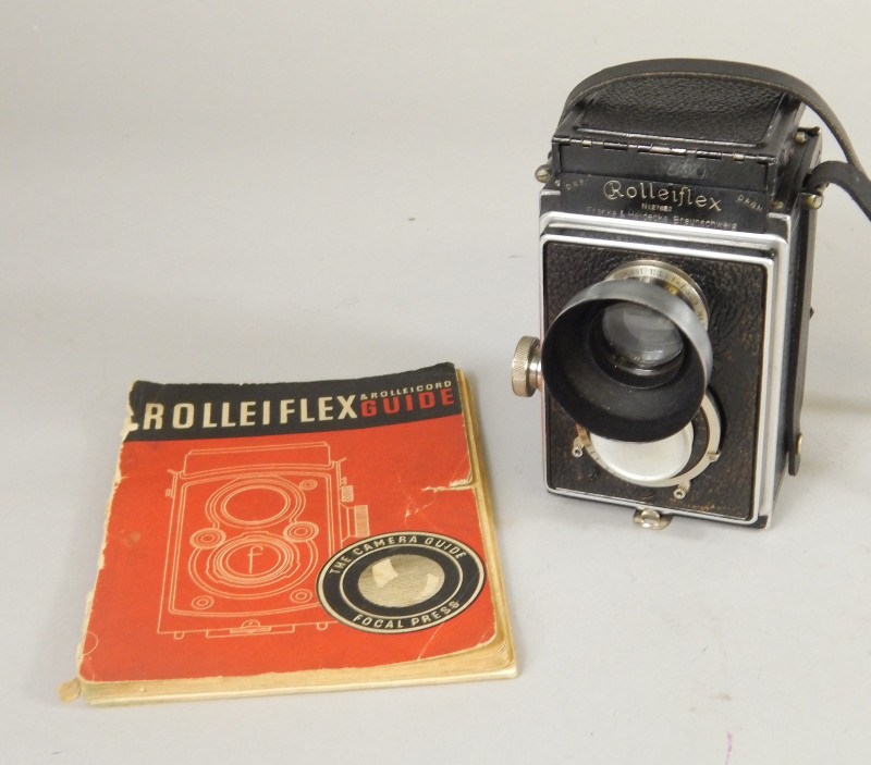 Appraisal: A Rolleiflex camera with guide book Lens marked mm