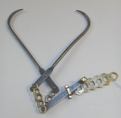 Appraisal: An unusual steel and brass meat hook early th century