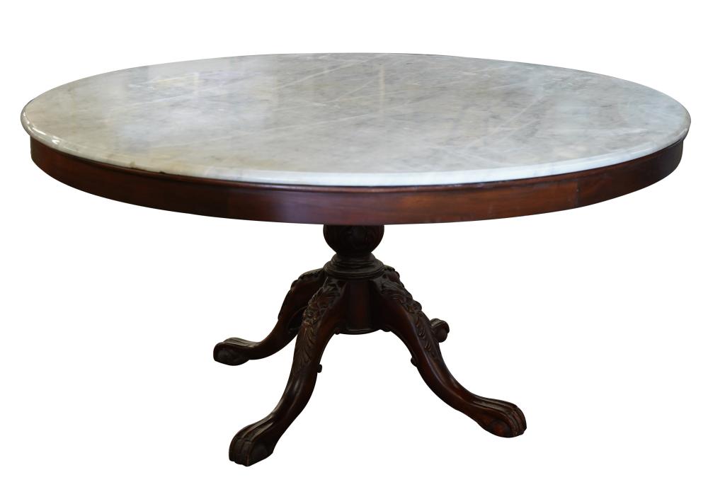 Appraisal: MARBLE-TOP ROUND DINING TABLE th century on a foliate carved