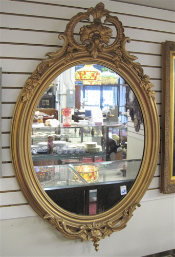 Appraisal: VICTORIAN OVAL GILT WOOD AND GESSO WALL MIRROR The heavy