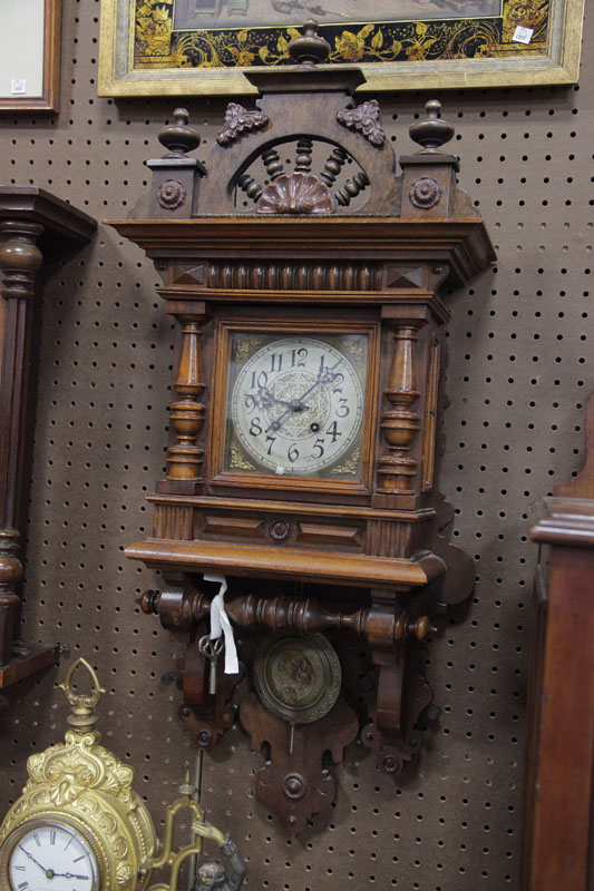 Appraisal: GERMAN WALL CLOCK Eight day time strike clock having brass