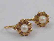 Appraisal: A pair of French hallmarked carat gold pearl earrings drop