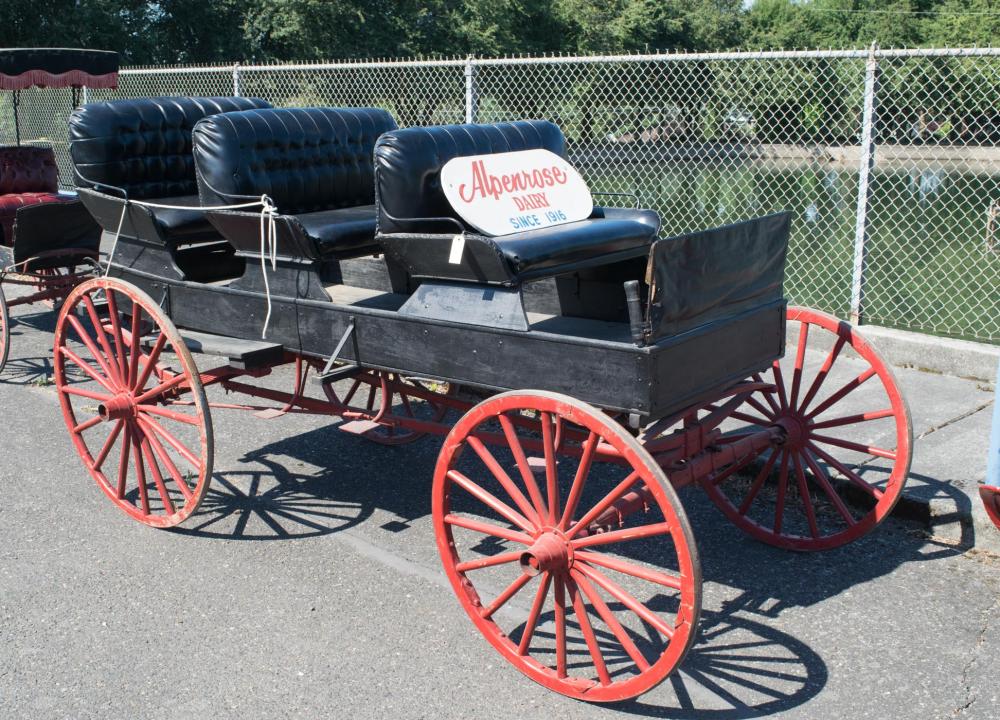 Appraisal: ANTIQUE THREE-SEAT SURREY American th century a four-wheeled open carriage