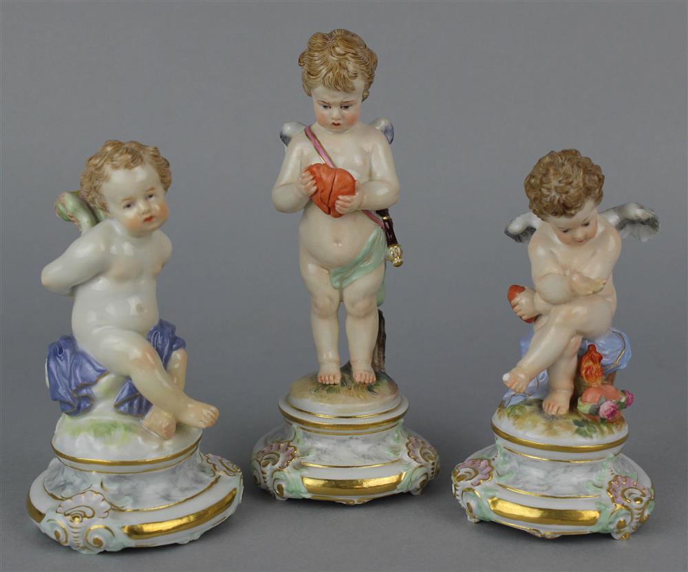 Appraisal: THREE MEISSEN PORCELAIN FIGURES OF PUTTI underglaze blue crossed swords