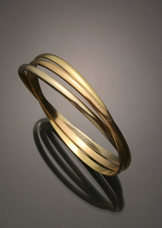 Appraisal: -Karat Tricolored-Gold 'Trinity' Bangle Bracelet Cartier Together with the original