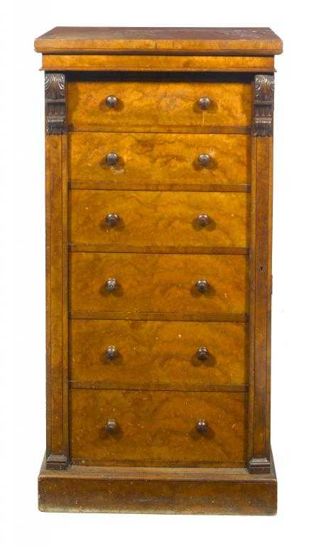 Appraisal: A VICTORIAN WALNUT WELLINGTON CHEST fitted with six graduated drawers