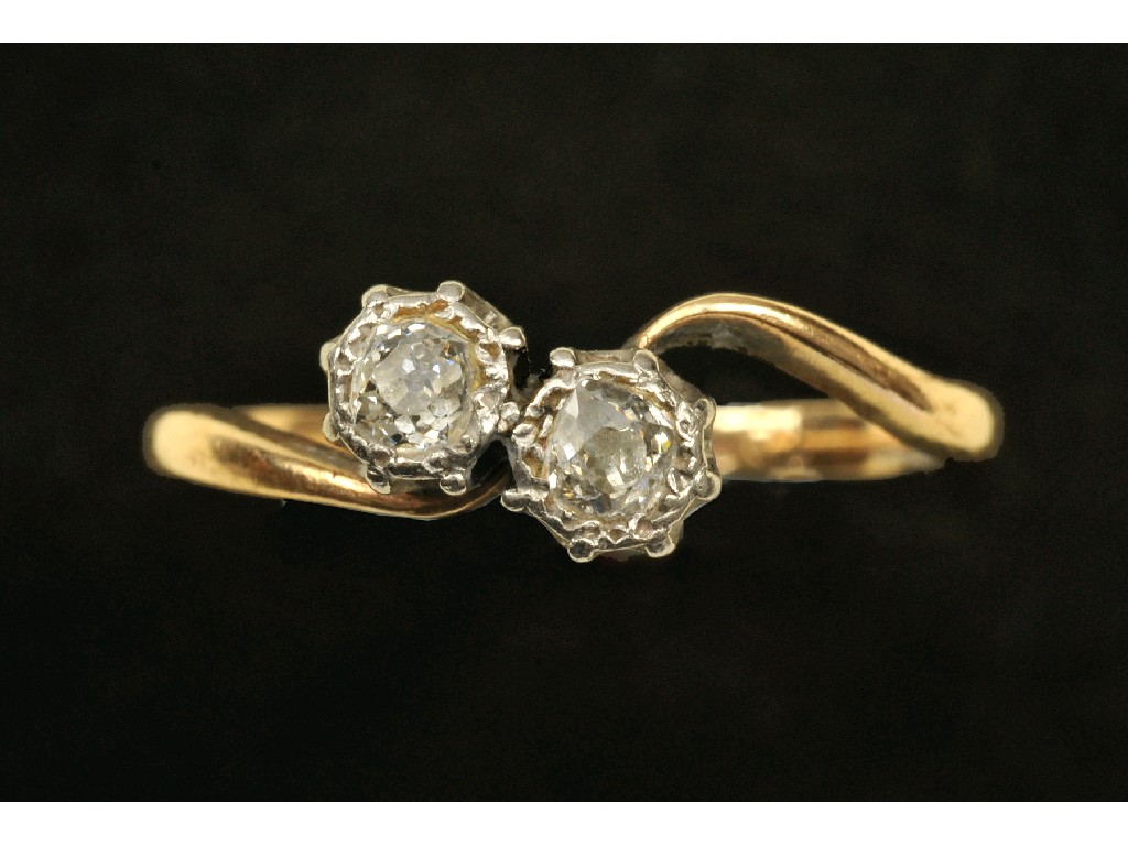 Appraisal: A Diamond two stone cross-over Ring the old-cut stones illusion-set