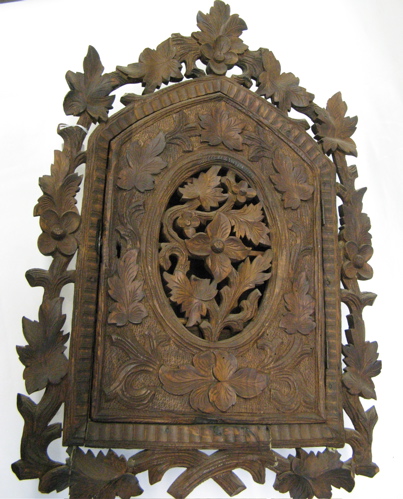 Appraisal: AN EAST INDIAN HAND CARVED WOOD WALL CABINET The pierced-carved