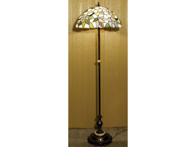 Appraisal: Bronze and onyx floor lamp with stained glass shade Estimate