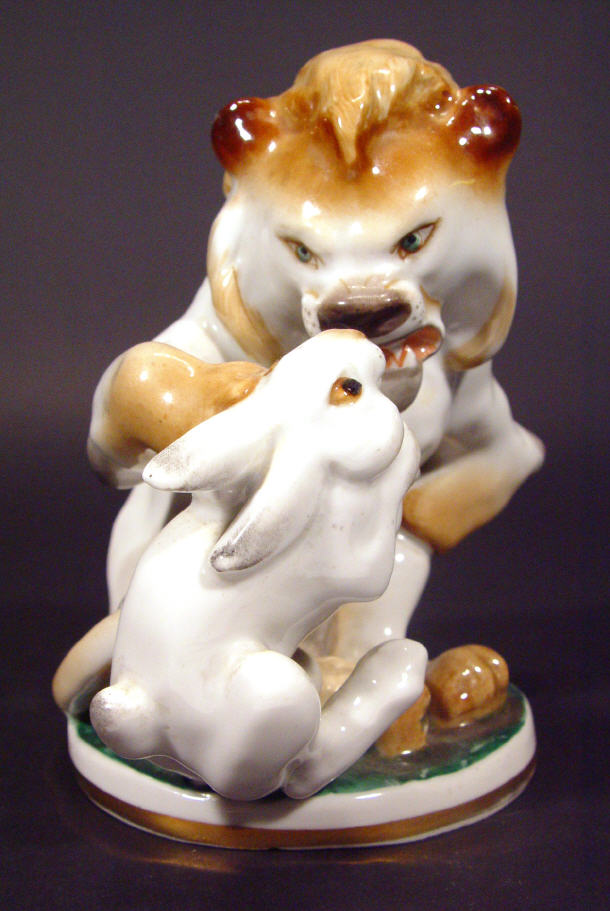 Appraisal: Hand painted USSR porcelain figure group a lion clutching a