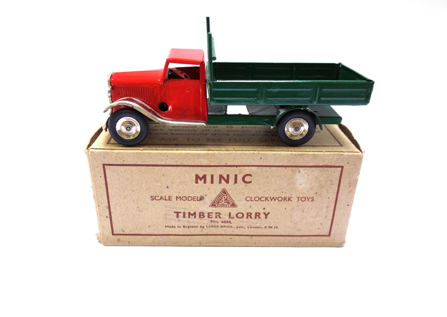 Appraisal: A Triang minic clockwork timber lorry boxed possibly re-painted