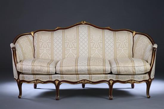 Appraisal: LOUIS XV STYLE PARCEL-GILT CANAPE th century striped damask upholstery