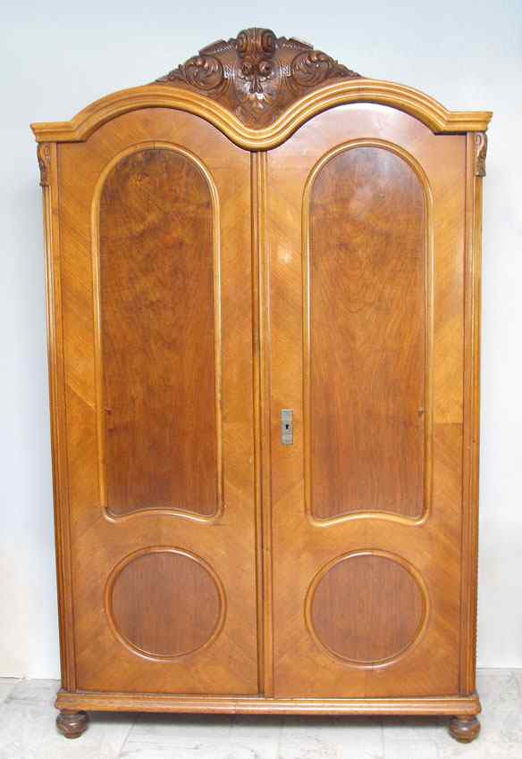 Appraisal: CARVED FRENCH ARMOIRE Carved crest shaped top paneled doors ''