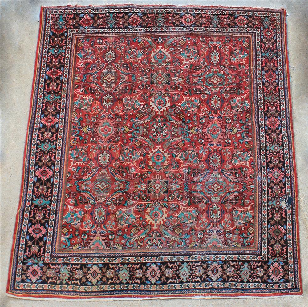 Appraisal: LARGE SULTANABAD WOOL RUG having a dark red field with