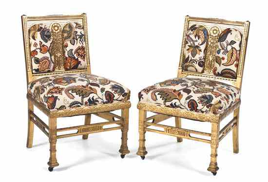 Appraisal: A Pair of Giltwood Aesthetic Slipper Chairs having stylized sunflower