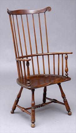 Appraisal: PENNSYLVANIA STAINED COMB-BACK WINDSOR ARMCHAIR Formally a commode chair the