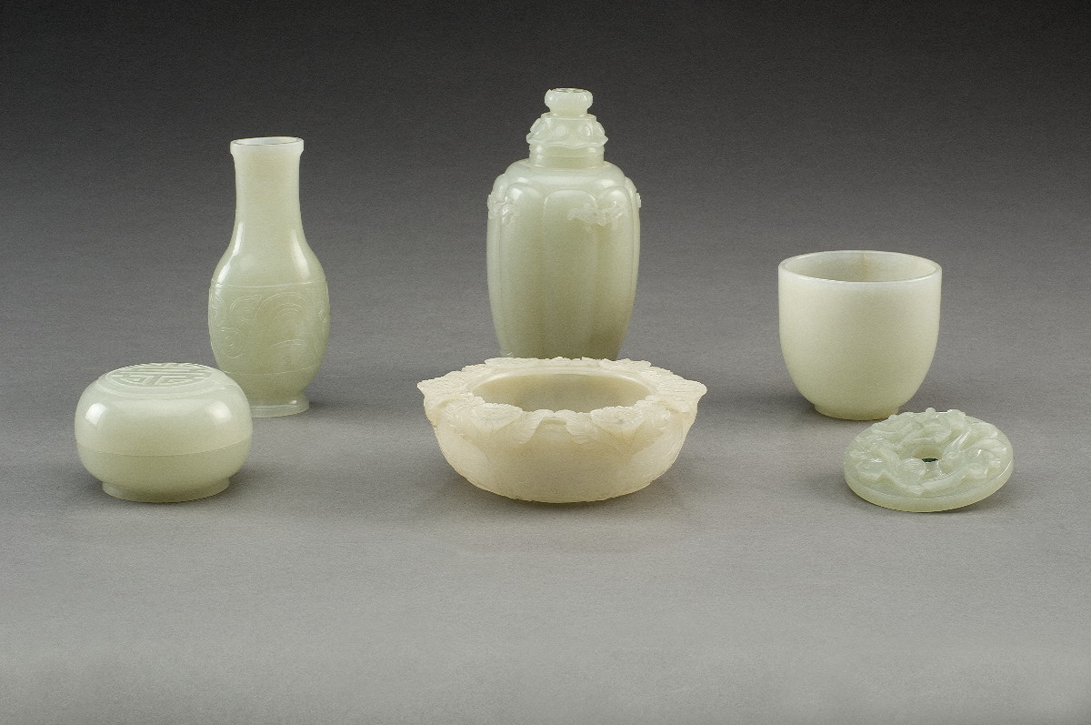 Appraisal: SIX LIGHT-GREEN AND WHITE CARVED JADE TABLE OBJECTS Comprising a