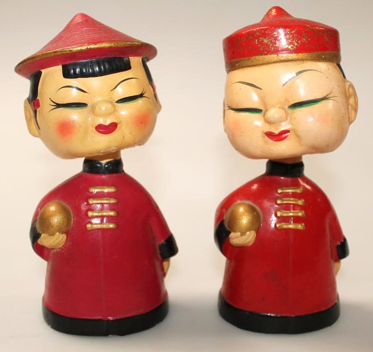 Appraisal: A pair of thC papier mache nodding head figures each