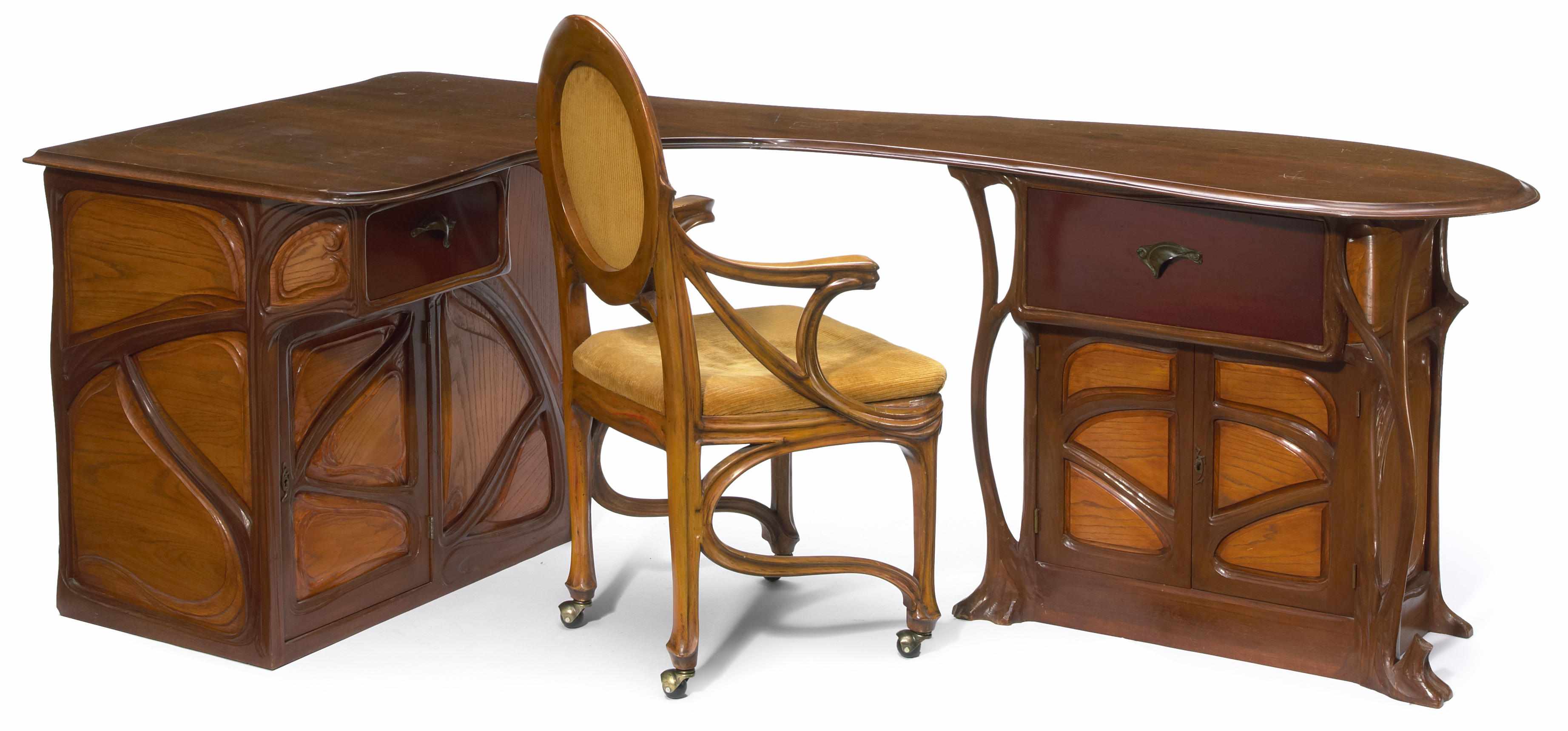 Appraisal: An Art Nouveau style carved and stained mixed wood desk