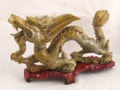 Appraisal: A large carved Chinese hardstone dragon on stand length cm