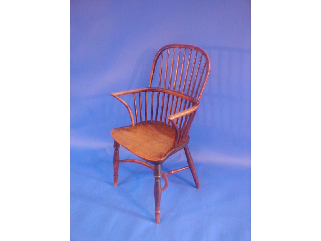 Appraisal: An early thC yew wood Windsor chair with spindle back